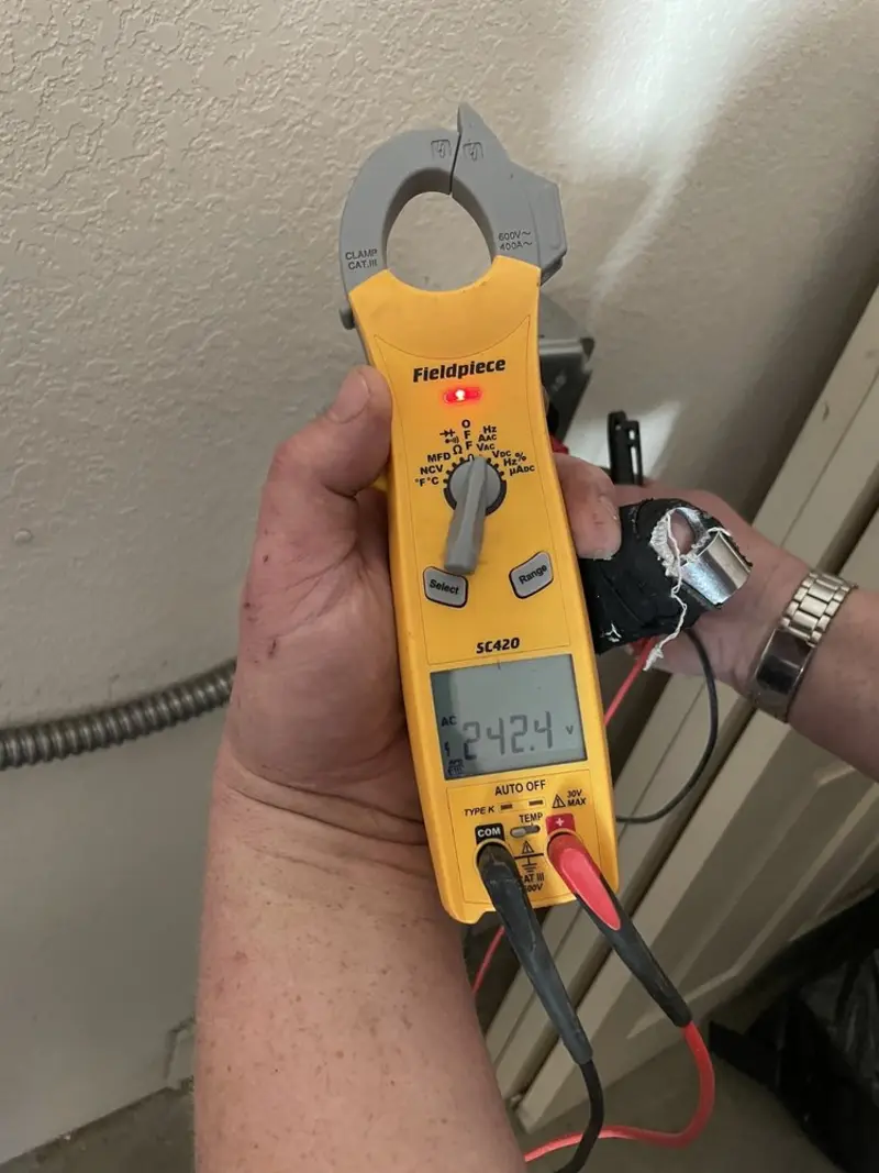 Voltage testing with clamp meter during Aluminum Wiring Replacement in Graham